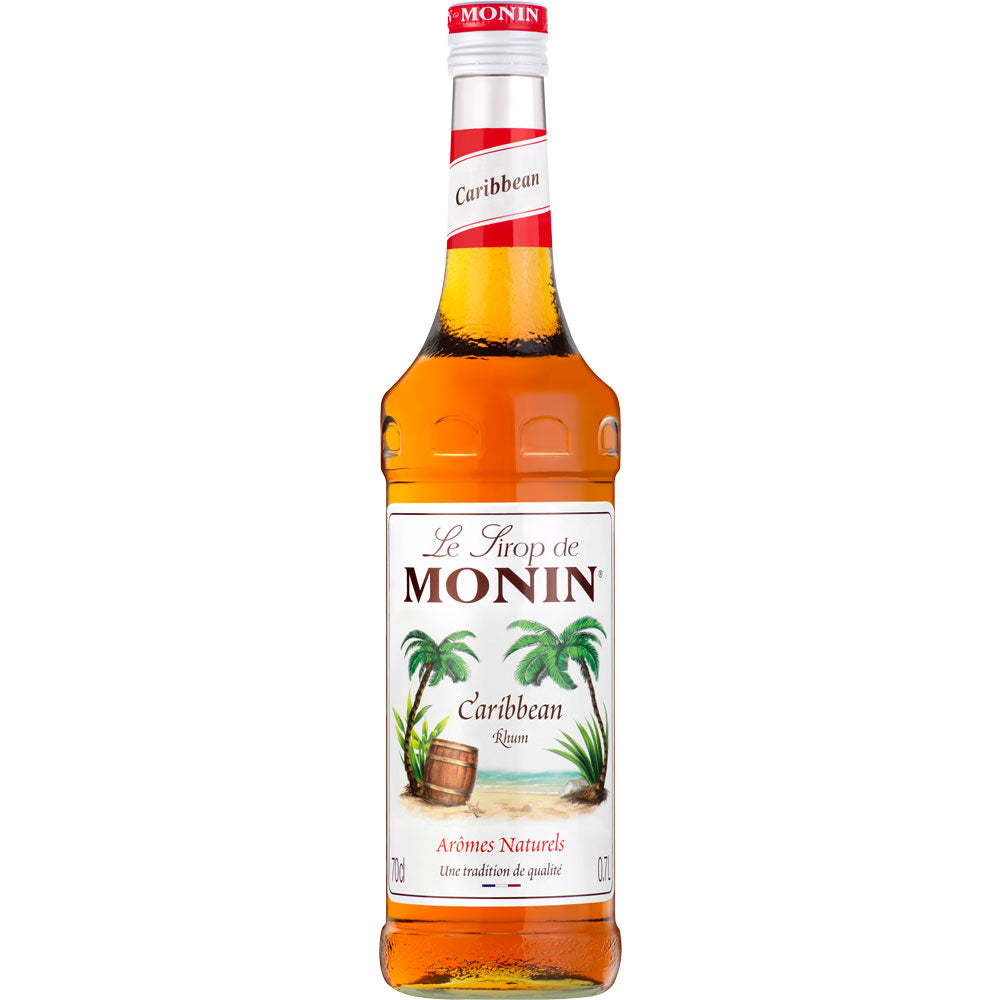 Eine 0,7-Liter-Flasche Monin Caribbean Rum Sirup von Monin - alkoholfrei, mit Palmen- und Holzfass-Etikett für authentischen Rumgeschmack ohne Alkohol.