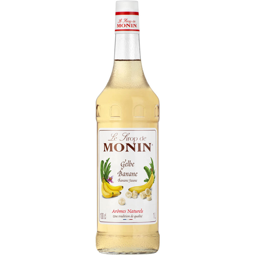 Eine 1-Liter-Flasche Monin Gelbe Banane Sirup von Monin mit Abbildungen von Bananen und Bananenscheiben auf dem Etikett.