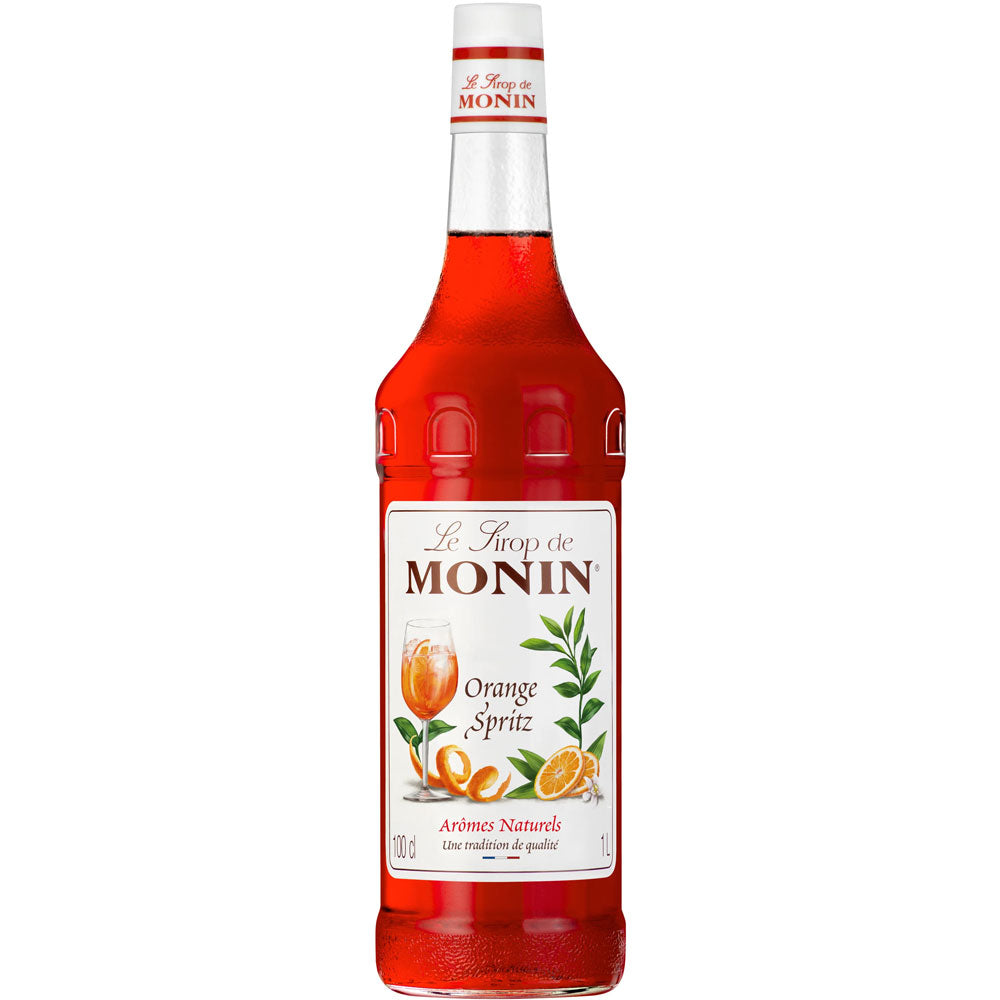 Monin Orangen Spritz Sirup 1 Liter zeigt ein Orangengetränk und Früchte auf dem Etikett - ideal zum Mixen eines erfrischenden Spritz Cocktails oder zum Genießen als alkoholfreier Orangen Sirup.