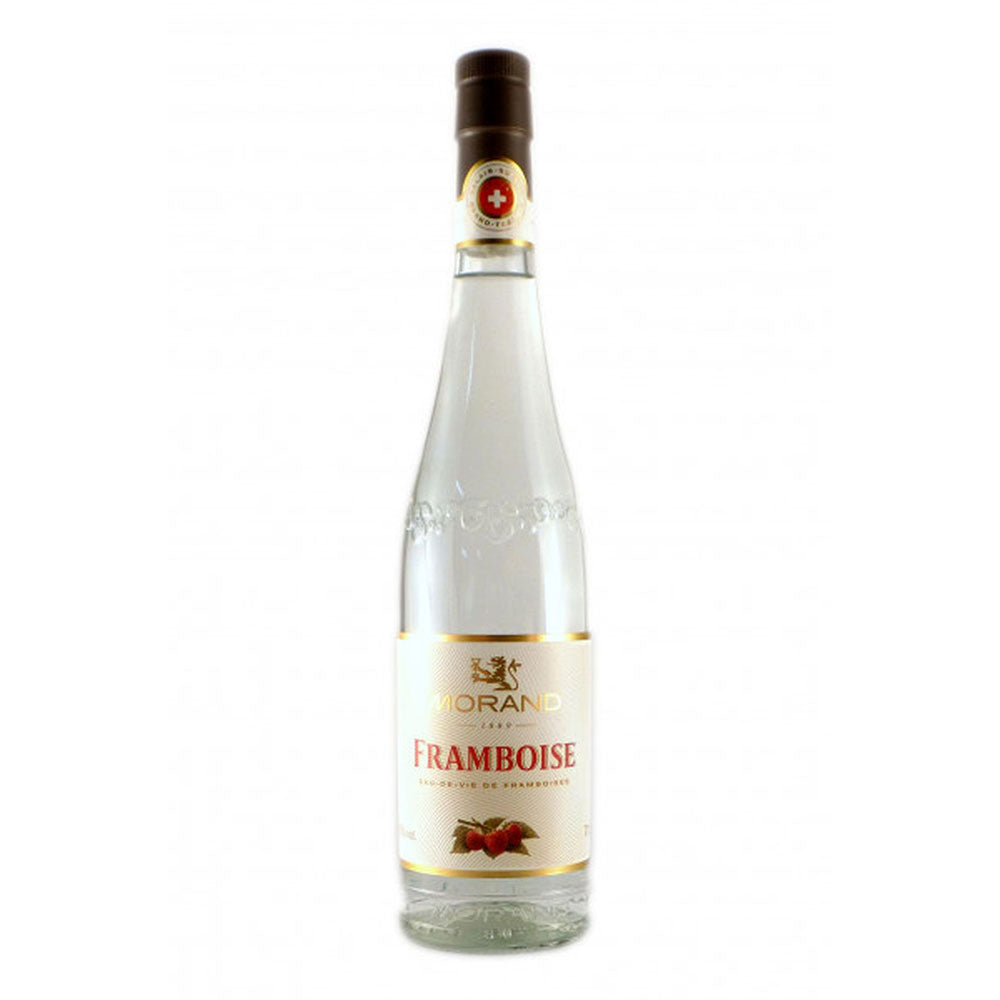 Morand Framboise Himbeergeist 43% (0,7L) von Morand kommt in einer klaren Glasflasche mit weißem Etikett und braunem Verschluss - ein erstklassiger Schweizer Himbeergeist, perfekt für Liebhaber.