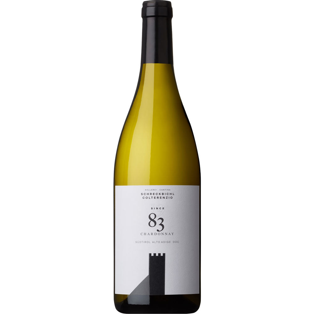 Eine Flasche Schreckbichl Colterenzio Since 83 Chardonnay Alto Adige DOC 2023, ein italienischer Weißwein mit weißem Etikett und schwarzem Verschluss von Schreckbichl Colterenzio.