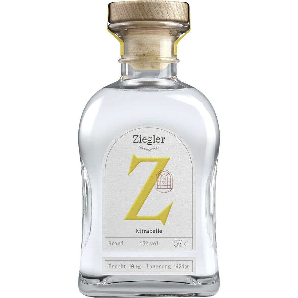 Eine Klarglasflasche Ziegler Mirabellenbrand 43% 0,5 Liter mit einem Holzdeckel und einem weißen Etikett mit einem markanten gelben Z.