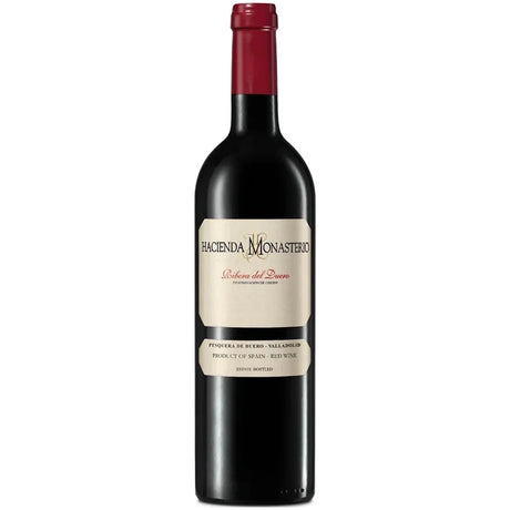 Eine Flasche „Hacienda Monasterio Cosecha Ribera del Duero DO 2022“, ein Rotwein von Hacienda Monasterio mit cremefarbenem Etikett und roter Folie am Flaschenhals, der hauptsächlich aus der Rebsorte Tinto Fino gekeltert wird.