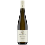 Eine Flasche Weißwein „Weingut Dönnhoff Riesling Tonschiefer trocken 2023“ mit cremefarbenem Etikett und goldenem Emblem, die den lebendigen Charakter der Nahe-Weine zum Ausdruck bringt.