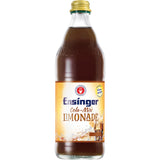 Eine Glasflasche Ensinger Cola Mix 0,5L (Mehrweg) von Ensinger, mit gelbem Etikett und goldenem Verschluss, hergestellt mit Ensinger Mineralwasser und perfekt für eine vegane Ernährung.