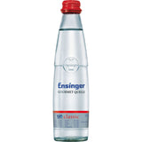 Ensinger Gourmet BIO Classic 24x0,25L (MEHRWEG): Premium-Mineralwasser in Glasflaschen mit blauem Etikett und rotem Verschluss für die klassische Erfrischung.