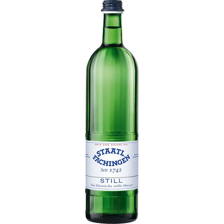 Eine grüne Glasflasche von Staatl. Fachingen Heilwasser Still 0,75L (MEHRWEG) mit einem weiß-blauen Etikett, das das hochwertige natürliche Heilwasser von Staatl. Fachingen; erhältlich im 12er-Pack.