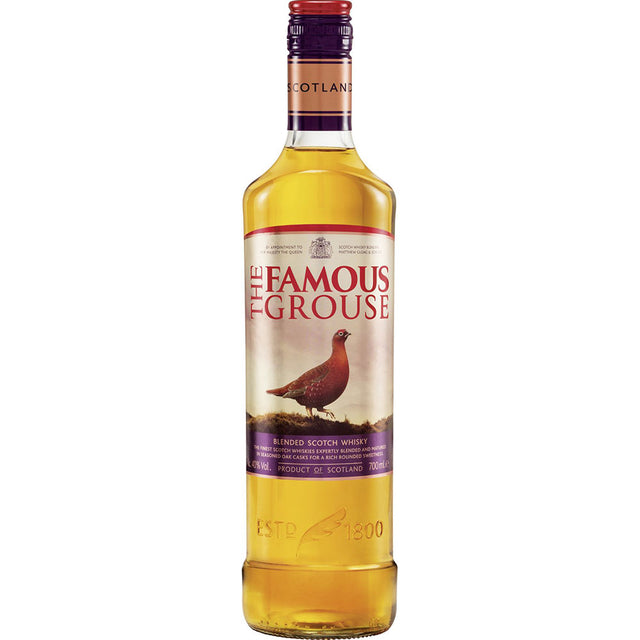 Eine 0,7-Liter-Flasche The Famous Grouse Finest Blended Scotch Whisky (40%) zeigt ein rotes Moorhuhn auf dem Etikett und ist für seinen weichen, ausgewogenen Geschmack bekannt.