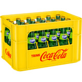 Eine gelbe Kiste, gefüllt mit 24 grünen Glasflaschen Fanta Exotic (je 0,33 l, MEHRWEG), alle mit grünen Etiketten.