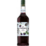 Eine 1-Liter-Flasche Giffard Brombeere Sirup Mûre von Giffard mit illustrierten Brombeer- und Blattmotiven auf dem Etikett.