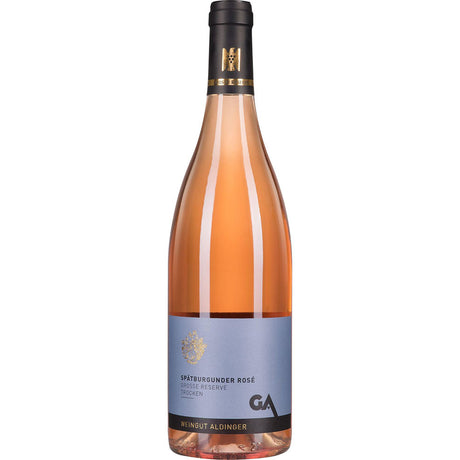 Eine Flasche Aldinger Große Reserve Spätburgunder Rosé trocken 2023 mit blauem Etikett und goldenen Akzenten von Aldinger.