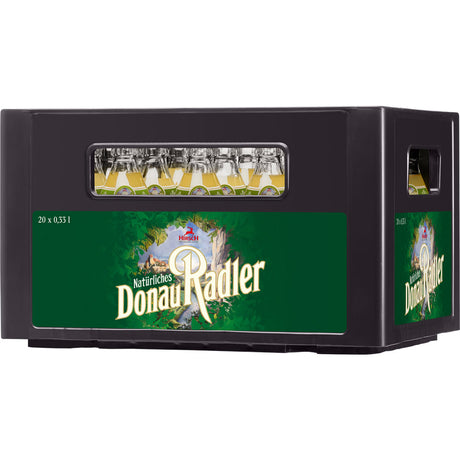 Ein Kasten Hirsch Brauerei Donau Radler Alkoholfrei 0,0% MEHRWEG (20x0,33L) Flaschen mit grünem Etikett und Sichtfenster, das den Alkoholfreier Radler zeigt.