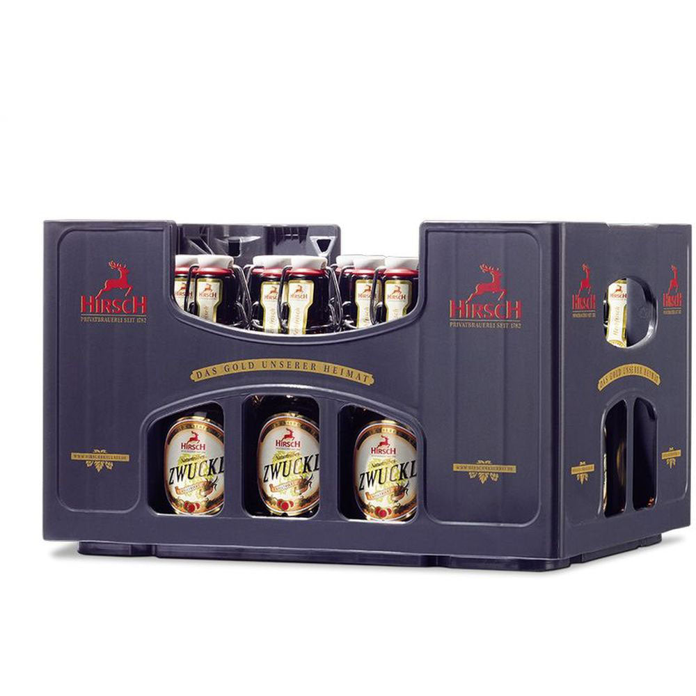 Eine Kiste Hirsch Brauerei Zwuckl Bügel 20x0,33L (MEHRWEG) Bierflaschen in einem schwarzen Träger mit rotem und goldenem Branding, die den klassischen Zwuckelbierstil zeigen.