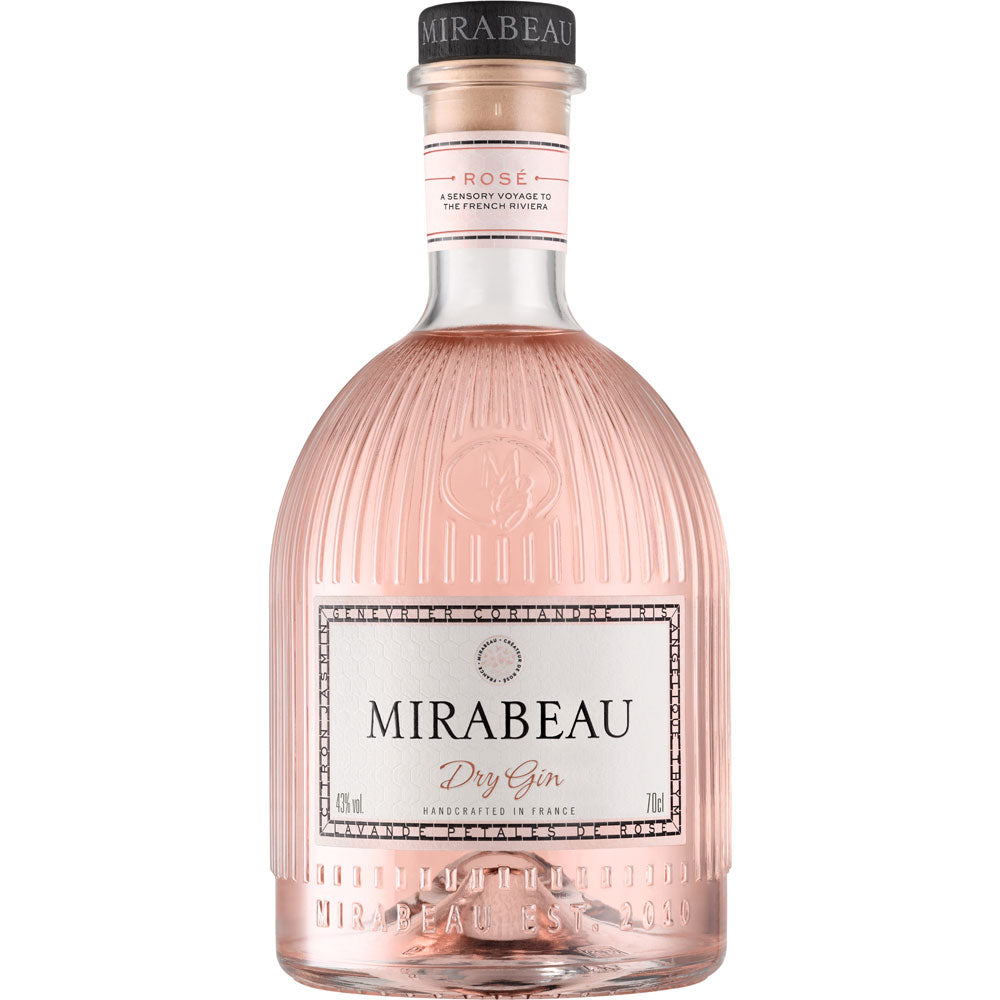 Eine klare, rosafarbene 0,7-Liter-Flasche des Mirabeau Dry Rosé Dry Gin (43%) von Maison Mirabeau mit einem strukturierten Glasdesign, das die Eleganz der provenzalischen Handwerkskunst widerspiegelt.