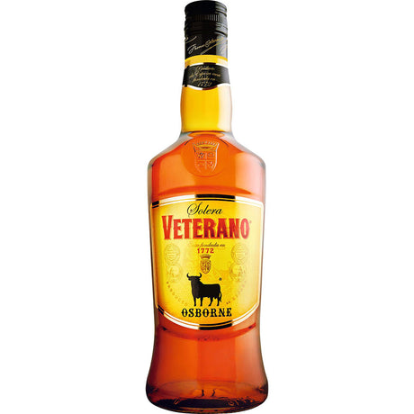 Eine 1-Liter-Flasche Osborne Veterano 30% Brandy mit gelbem Etikett und dem typischen schwarzen Stier-Logo der Marke Osborne auf der Vorderseite.