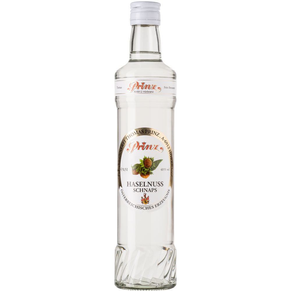 Prinz Haselnuss Schnaps 40% 0,5 Liter von der Feinbrennerei Thomas Prinz in einer Klarglasflasche mit weißem Etikett und Haselnussabbildung.