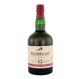 Eine 0,7-Liter-Flasche Redbreast 12 Jahre Single Pot Still Irish Whiskey (40%) mit cremefarbenem und rotem Etikett und rotem Verschluss.