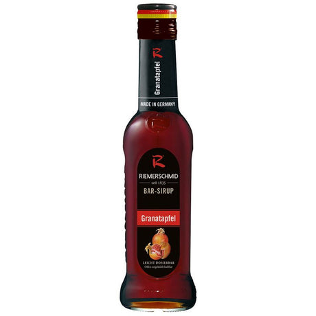 Eine 0,7-Liter-Flasche Riemerschmid Bar-Sirup Granatapfel, ideal für Grenadine-Cocktails, ist mit einem roten Etikett und einem schwarzen Verschluss versehen.