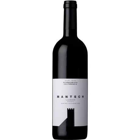 Eine Flasche Schreckbichl Colterenzio Mantsch Lagrein Riserva Alto Adige DOC 2022, ein raffinierter Südtiroler Rotwein mit einem minimalistischen schwarz-weißen Etikett von Schreckbichl Colterenzio.