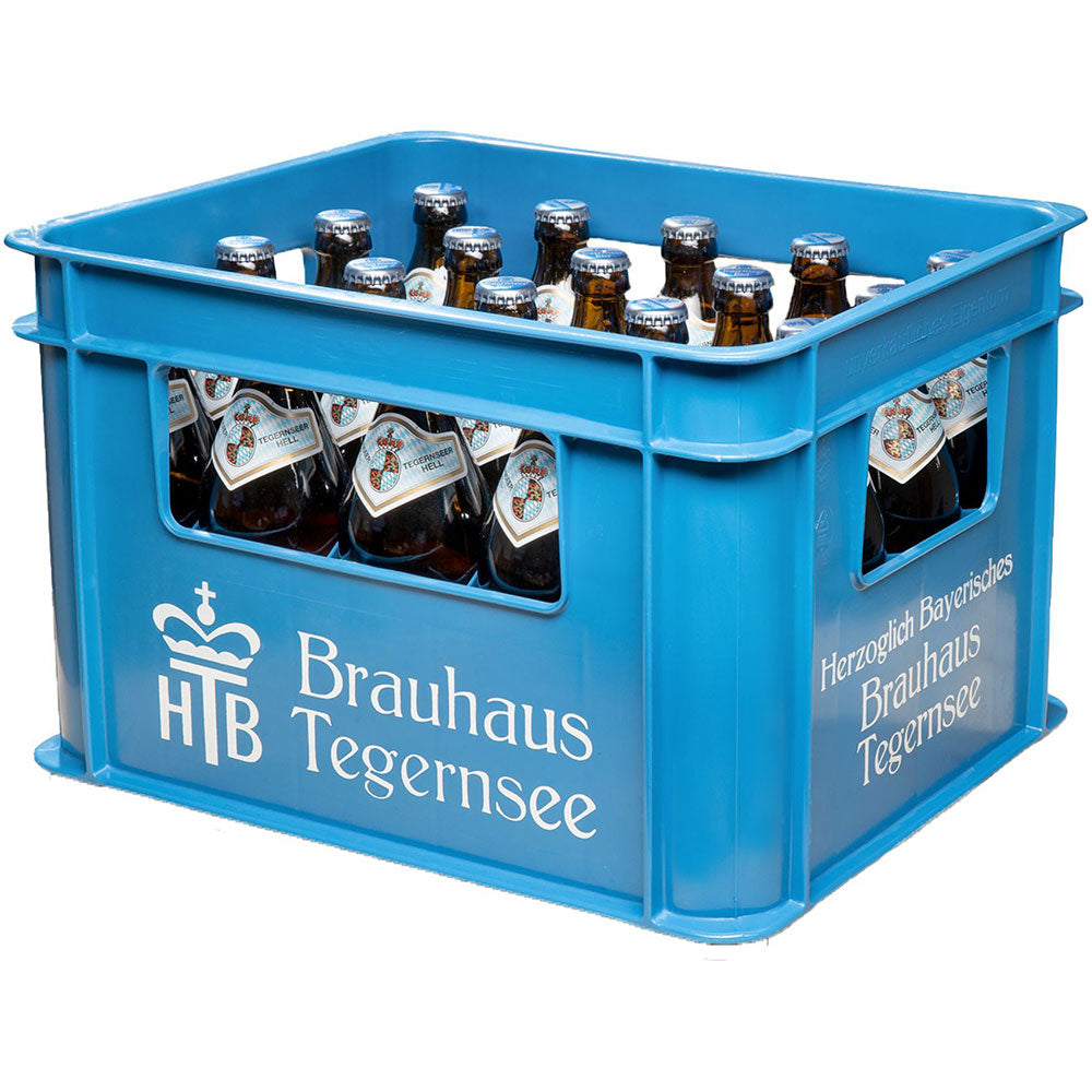 Blaue Kiste Tegernseer Hell 20x 0,5L (Mehrweg), ein klassisches bayerisches Helles Lagerbier der Marke Tegernseer, mit dem Logo der Brauerei und dem Branding aus dem Tegernseer Tal.