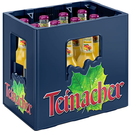 Eine blaue Kiste mit der Aufschrift Teinacher Mineralwasser enthält 12 Glasflaschen (0,33 l MEHRWEG) Teinacher Genuss-Limo Mango-Maracuja-Orange mit gelber Flüssigkeit und lila Verschlusskappen für einen erfrischenden, vom Schwarzwald inspirierten Geschmack.