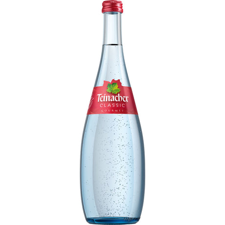 Eine Klarglasflasche Teinacher Mineralwasser Gourmet Classic 0,75L (Mehrweg), mit rotem Etikett und sichtbaren Kohlensäureblasen.