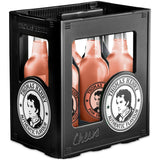 Schwarze Kiste mit sechs Flaschen Thomas Henry Pink Grapefruit 0,75 l MEHRWEG, einem Premium-Mixer für Longdrinks, mit Etiketten, die das Porträt eines Mannes zeigen.