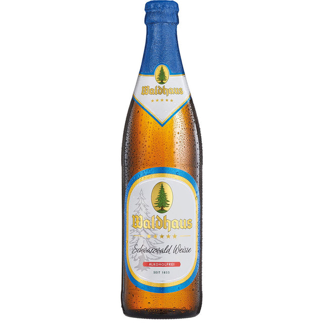 Eine Waldhaus Schwarzwald Weisse Alkoholfrei 0,5L Flasche mit blauem Verschluss und grünem Baumetikett - Ihr idealer kalorienreduzierter Durstlöscher. Erhältlich als 20x 0,5L (MEHRWEG) bei Waldhaus.