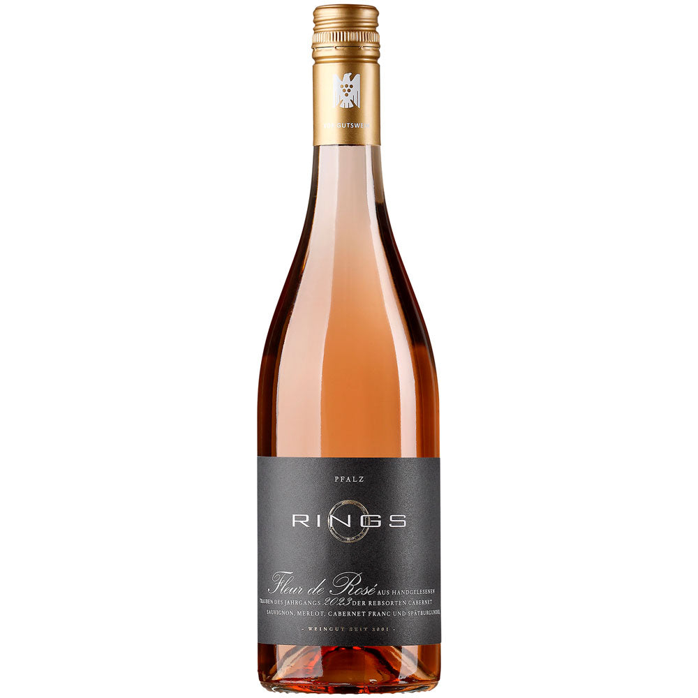 Eine Flasche Weingut Rings Fleur de Rosé VDP.Gutswein trocken 2025 mit schwarzem Etikett und goldenem Verschluss auf weißem Grund.