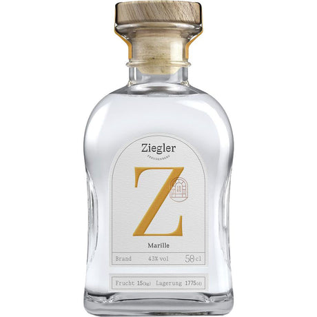 Der Ziegler Marillenbrand 43% 0,5 Liter kommt in einer Klarglasflasche mit Holzkappe und weißem Etikett mit markantem goldenem Z, das die Eleganz dieser Premium-Spirituose von Ziegler widerspiegelt.