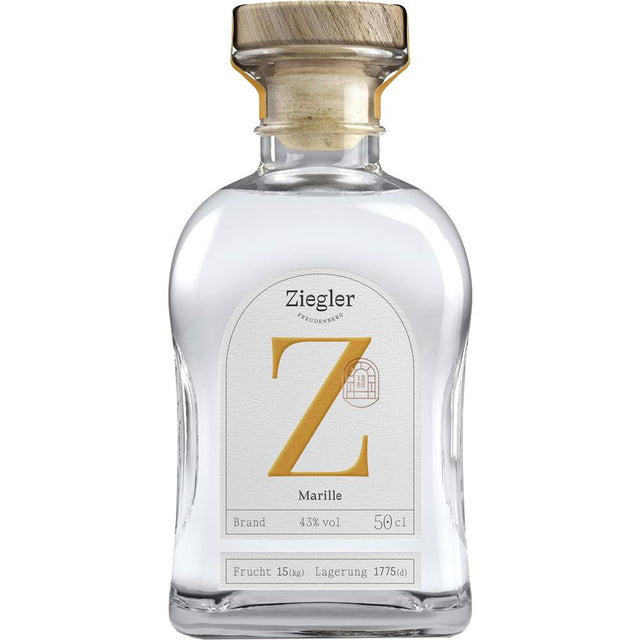 Der Ziegler Marillenbrand 43% 0,5 Liter kommt in einer Klarglasflasche mit Holzkappe und weißem Etikett mit markantem goldenem Z, das die Eleganz dieser Premium-Spirituose von Ziegler widerspiegelt.