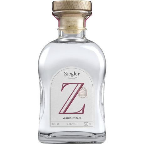 Ziegler Waldhimbeergeist 43% 0,5 Liter: Eine Klarglasflasche mit Holzkorken und weißem Etikett, hergestellt von Ziegler aus Waldhimbeeren für ein authentisches Obstbrand-Erlebnis.