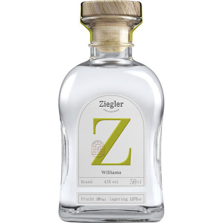Eine Klarglasflasche Ziegler Williams Birnenbrand 43% 0,5 Liter von Ziegler mit einem Holzkorken und einem großen grünen Z auf dem Etikett, das den klassischen Williams-Christ-Birnenbrand hervorhebt.